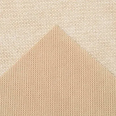A close-up view of two textured materials, likely fabric or fleece, layered diagonally.