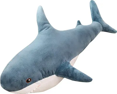 A plush toy shark on a white background.