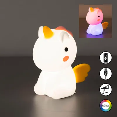 A white silicone unicorn night light is shown on a dark surface with a gray background. An inset image shows the unicorn lit up in various colors.