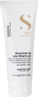 A white tube of shampoo with gold lettering and a gold logo.