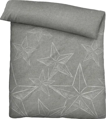 A folded duvet cover with a star pattern is shown from a top-down perspective.
