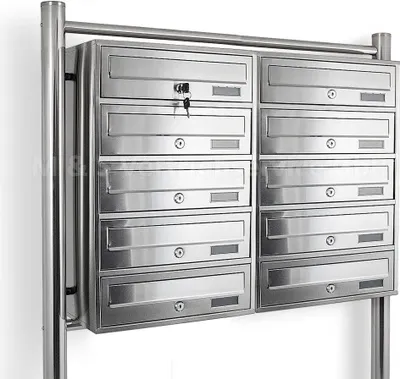 A stainless steel mailbox unit with multiple compartments.