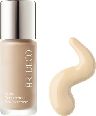 A bottle of foundation and a swatch of the product on a white background.