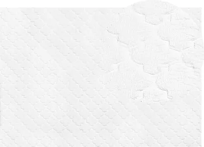 A close-up, textured view of a white rug with a scalloped pattern.