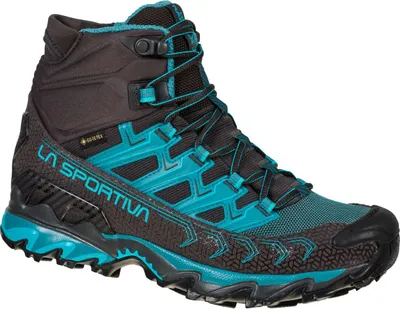 Wanderschuh für Damen; Modell "Ultra Raptor II Mid Wide Woman GTX" von La Sportiva in Schwarz und Türkis.