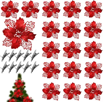 A collection of red artificial poinsettia flowers and silver clips arranged on a white background, with a small section of a Christmas tree visible at the bottom.