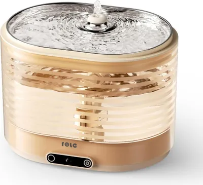 A pet water fountain with water flowing.
