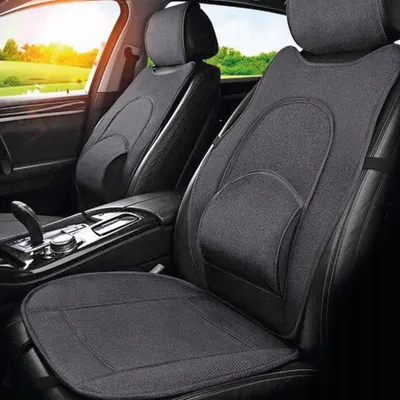 Interior of a car with seat covers installed on the front seats.