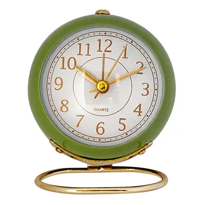 A green alarm clock with a gold stand against a white background.