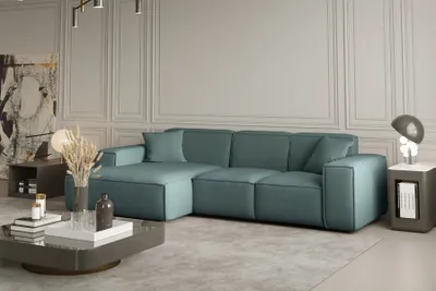 Produktbild von Ecksofa Designersofa CELES in Stoff Opera Velvet Petrol Ottomane Links