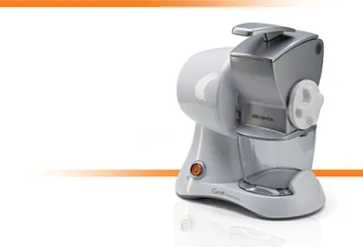 A white and silver electric cheese grater is shown on a white background with an orange gradient line.