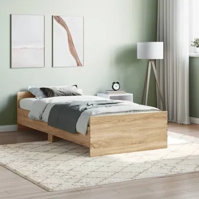 A bedroom scene with a bed, nightstand, lamp, and artwork.