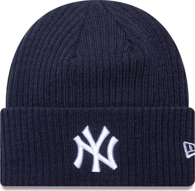 A navy blue New Era NY Yankees beanie with a white logo.
