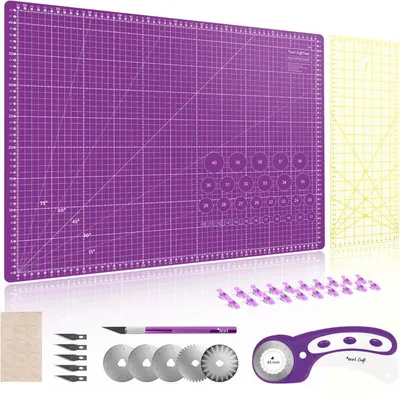 A set of sewing and crafting tools including a cutting mat, rotary cutter, blades, and ruler.