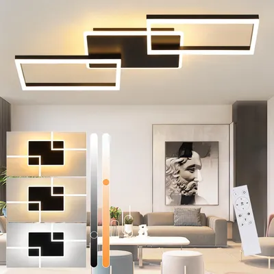 A modern living room with a stylish ceiling lamp and artwork.