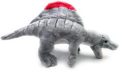A plush toy dinosaur, a Spinosaurus, is shown against a white background.