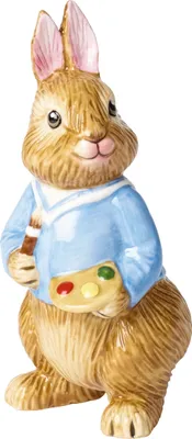 A ceramic figurine of a bunny dressed in a blue shirt, holding a paintbrush and a palette.