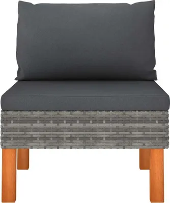 A front view of a sofa module with gray cushions and a woven rattan base, supported by wooden legs.