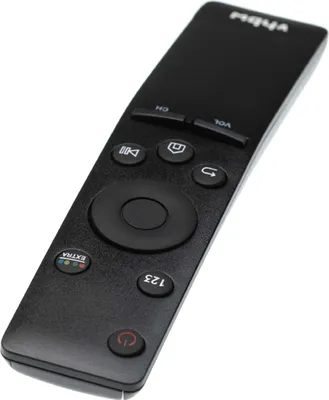 A black remote control is shown from a slightly elevated diagonal angle against a white background.