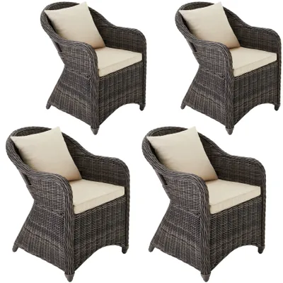Four wicker chairs with beige cushions are arranged in a grid on a white background.
