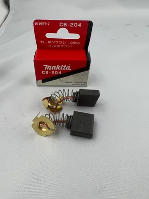 A product shot of Makita carbon brushes with their packaging.