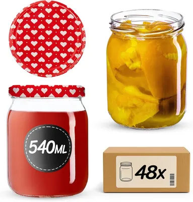 A collection of glass jars and a cardboard box, likely for canning or preserving food.