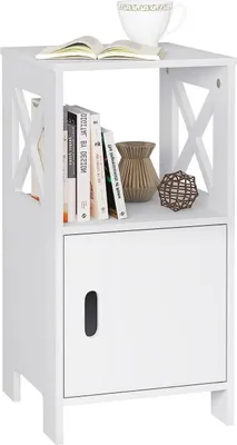 A white bedside table with a shelf and a cabinet, decorated with books and decorative items.