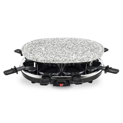 A raclette grill with a granite top and eight individual pans underneath.