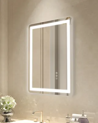 A modern LED bathroom mirror mounted on a textured wall above a sink.
