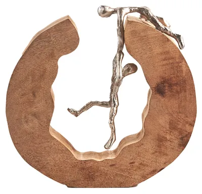 A decorative sculpture of two figures interacting with a wooden frame.