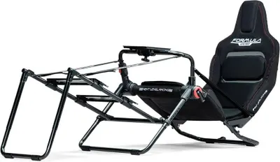 A black racing simulator cockpit with a black seat, shown against a white background.