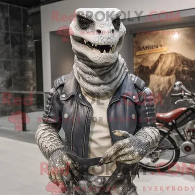 Immagine prodotto di Personaggio mascotte REDBROKOLY di un pitone grigio vestito con una giacca da motociclista e spille da scialle
