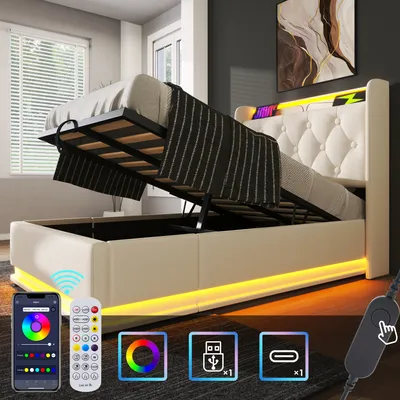 A bed with its storage compartment open, showing the hydraulic lift mechanism and the storage space underneath. The bed has a tufted headboard and LED lighting around its base and headboard. Several icons and a remote control are displayed in the foregroun