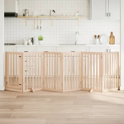 A wooden pet gate set up in a kitchen.