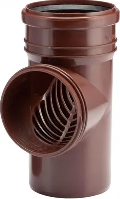 A brown pipe fitting with a grate.
