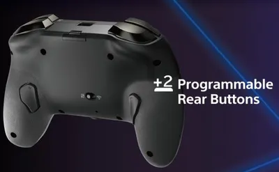 The back of a black game controller is shown with a graphic overlay highlighting its features.
