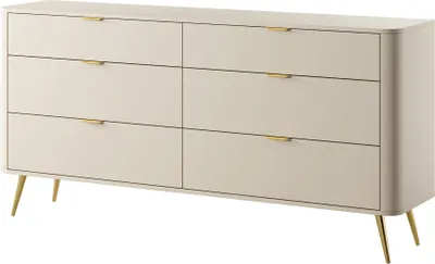 A beige dresser with six drawers and gold accents, shown from a front-side angle on a white background.
