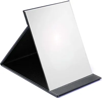 A black and white foldable makeup mirror is shown against a white background.