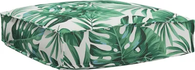 A square cushion with a tropical leaf pattern.