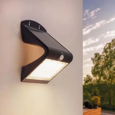 Produktbild von Ledvion - Moderne Solar LED Wandlampe, 4W, 3000K, IP65, Schwarz, 220 Lumen, Mit Bewegungssensor, Solarenergie, Energieeffizient & Wetterbeständig