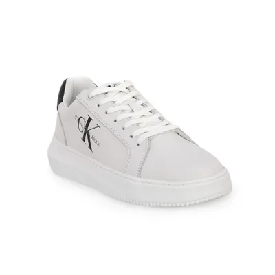 A white Calvin Klein sneaker with a black logo on a white background.