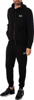 A man wearing a black tracksuit.