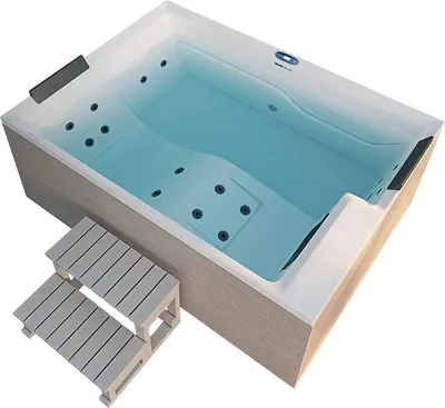 An outdoor whirlpool with steps next to it, set against a white background.