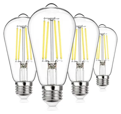 Four clear glass LED light bulbs with silver bases are arranged in a diagonal line against a white background.