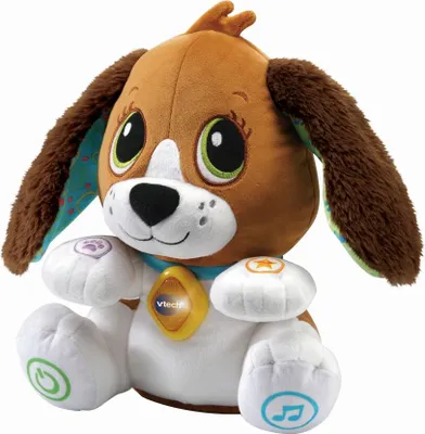 A plush toy dog sitting on a white background.