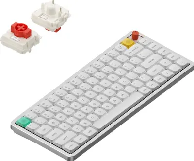 A white mechanical keyboard with some colorful keycaps and two separate key switches are shown on a white background.