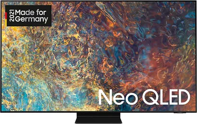A Samsung Neo QLED TV is displayed on a black stand against a dark background with abstract colorful patterns on the screen.