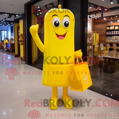 Obrázek produktu pro Postava REDBROKOLY maskota žluté bonboniéry s pouzdrovými šaty a taškami