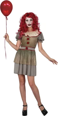 A woman in a horror clown costume holding a red balloon.