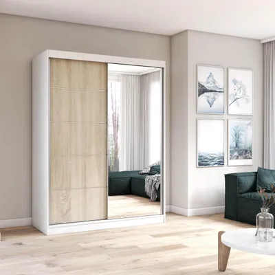 A wardrobe with sliding doors, one of which is mirrored, is shown in a room setting.